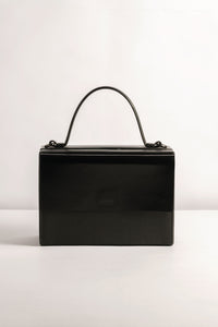Box Bag leather, Tann-ed, crafted in genuine leather with a top handle and side and crossbody sling