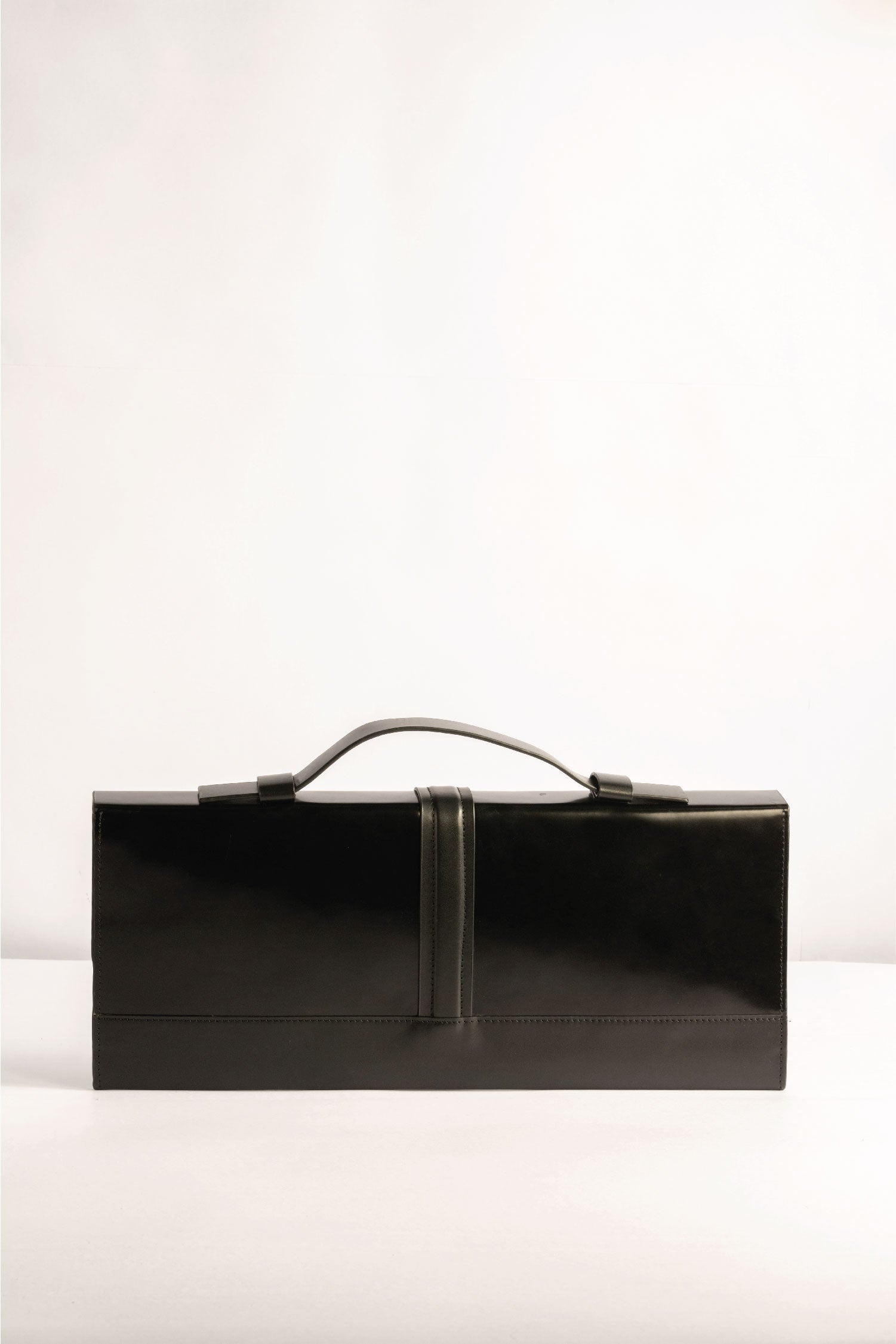 Capsule Bag Clutch in Black pure leather Tanned