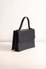 Load image into Gallery viewer, Top Handle Tann-ed black carrie bag with sling 
